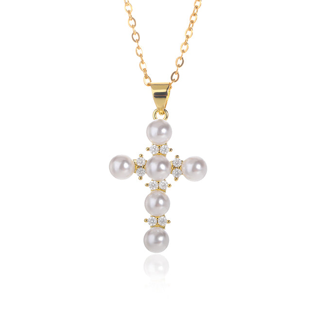 Goldene Jesus Kreuz Halskette mit Perlen - Ein religiöses Schmuckstück für moderne Frauen.