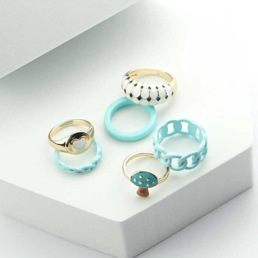 Horizon Ring Set in Blau mit Pilz- und Herzdesign aus 18K Gold - Eine einzigartige Kombination für einen trendigen Look.