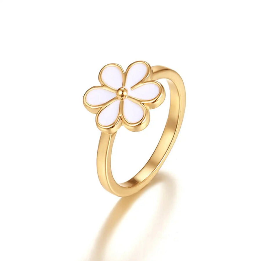 Weißer Blumenring - Anmutiger Ring aus 18K Gold mit einem zarten weißen Blumendesign, das Ihrem Stil eine elegante und feminine Note verleiht.